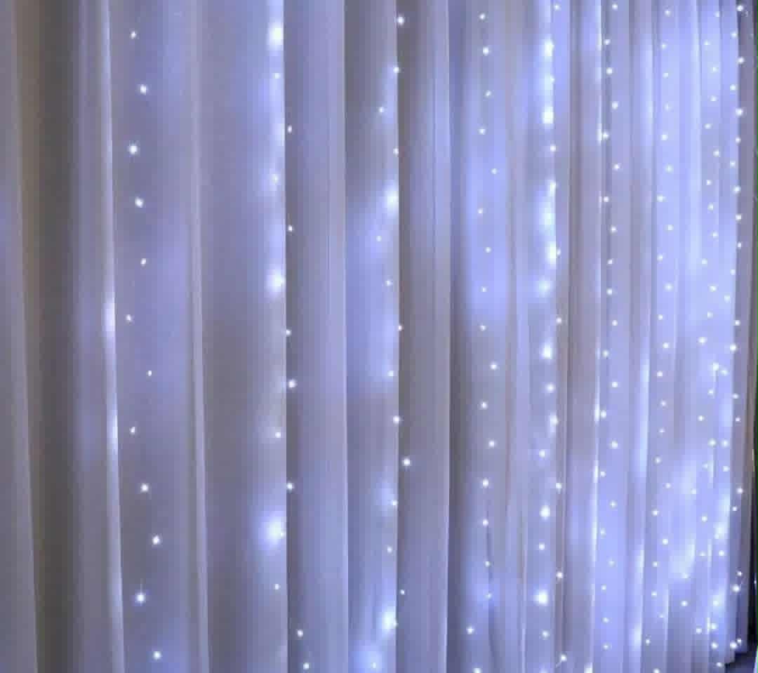 White curtain and cold white LED fairy light backdrop. Includes a $25 bond refunded after your hire.